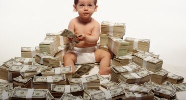 getty-rich-kid-baby-on-money